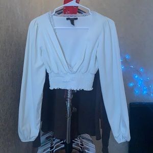 I’m selling a blouse from Forever 21. It’s a size small. The color is white.
